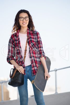 Hipster with skateboard