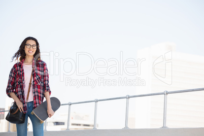 Hipster with skateboard