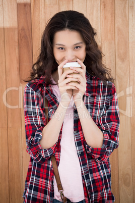 Hipster holding a cup of coffee