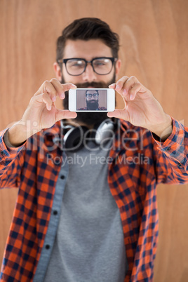 Hipster taking a selfie