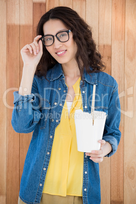 Hipster eating with chopsticks