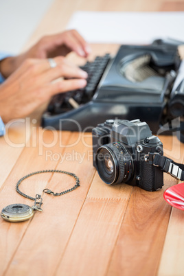 Hipster using type writer