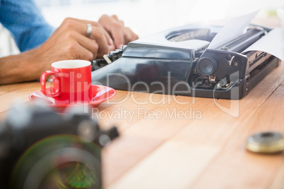 Hipster using type writer