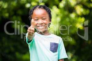 Smiling boy with thumbs up