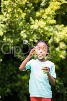 Boy is blowing bubbles