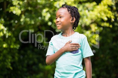 Boy with his hand on chest
