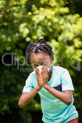 Boy sneezing his nose