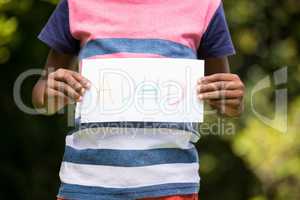 Boy showing a poster with ADHD