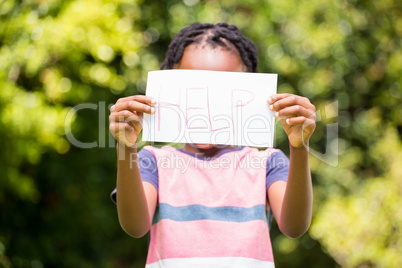 Boy holding a poster with help