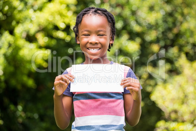 Smiling boy holding a poster