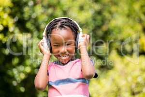 Smiling boy listening to music