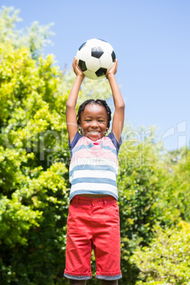 Smiling boy holding a ball