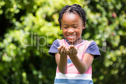 Smiling boy looking at his hands Smiling boy looking at his hands
