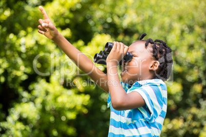 Boy using a magnifying glass