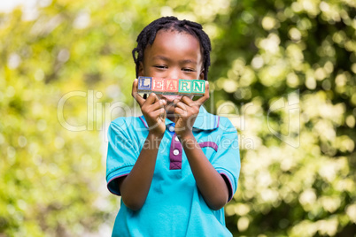 Boy holding the word learn