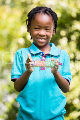 Boy holding the word learn