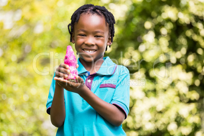 Smiling boy holding a chocolate bunny