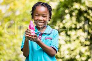 Smiling boy holding a chocolate bunny