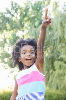 Smiling child with hand up