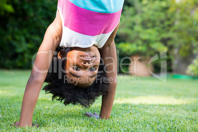 A kid doing a headstand