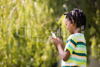 A kid playing with a mobile phone