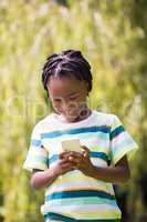 A kid playing with a mobile phone