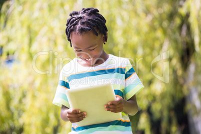 A kid playing with a tablet computer