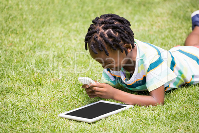 A kid playing with a mobile phone
