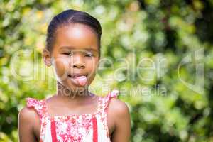 Portrait of kid sticking her tongue out