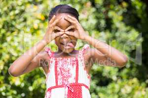 A little girl making faces