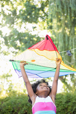 A child is holding a kite