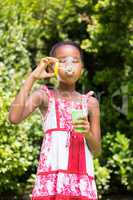 Little girl is making bubble