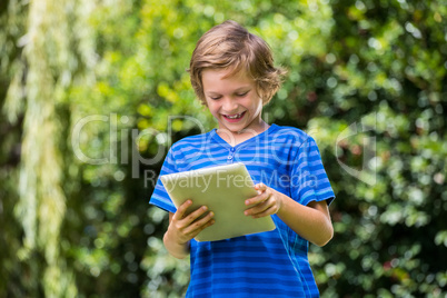 A little boy is playing with tablet computer