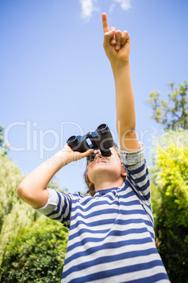 Low angle view of a child looking something with binoculars and