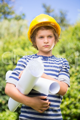 Portrait of a cute boy pretending to be a worker