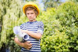 Portrait of serious boy pretending to be a worker