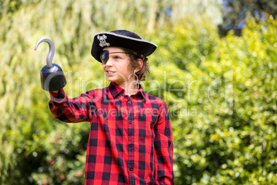 A kid is playing in costume of pirate