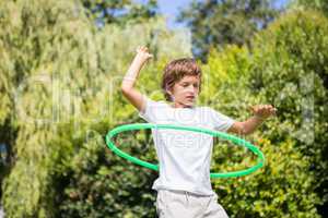 Child playing with a hoop