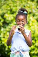 Cute mixed-race girl eating a watermelon