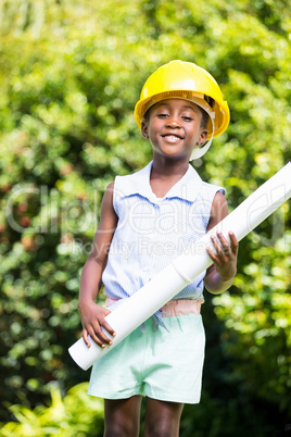 Cute mixed-race girl wearing handyman clothes