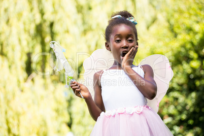 Cute mixed-race girl wearing a fairy dress