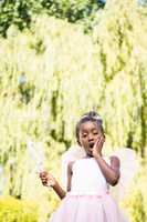 Cute mixed-race girl wearing a fairy dress