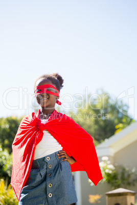 Cute mixed-race girl smiling and wearing a fancy dress