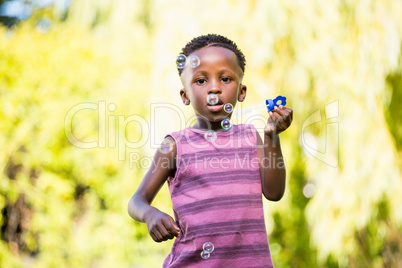Boy playing with bubble