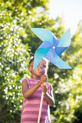 Boy playing with a pinwheel