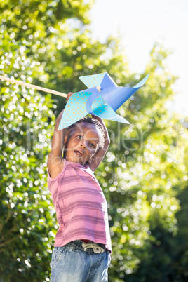 Boy playing with a pinwheel