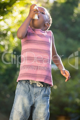 Boy using a asthma inhalator