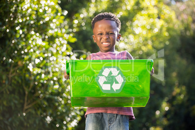 Boy carrying a recycle trash