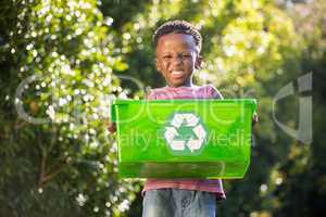Boy carrying a recycle trash