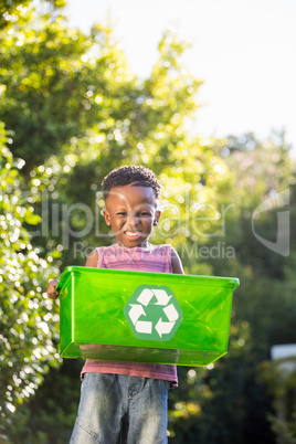 Boy carrying a recycle trash